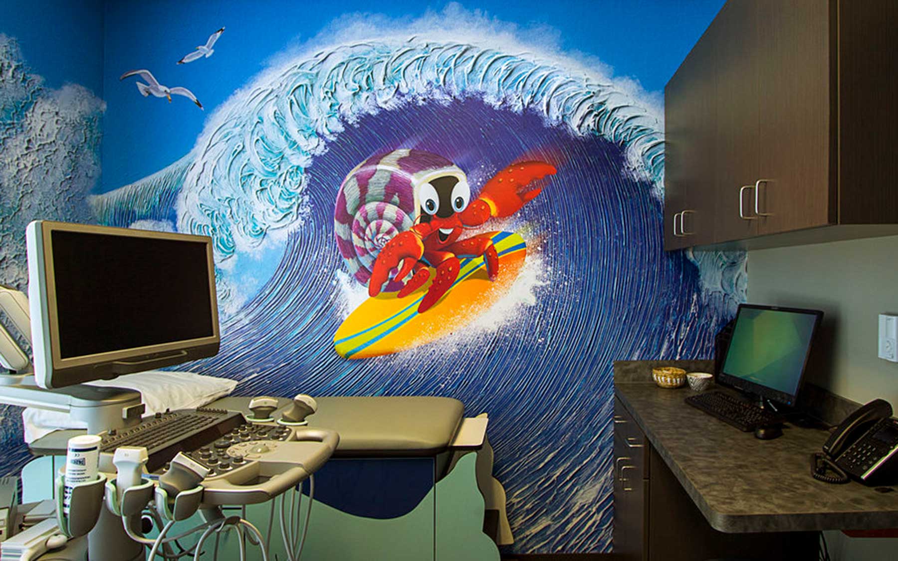 An ultrasound instalation in a room with a large mural for children